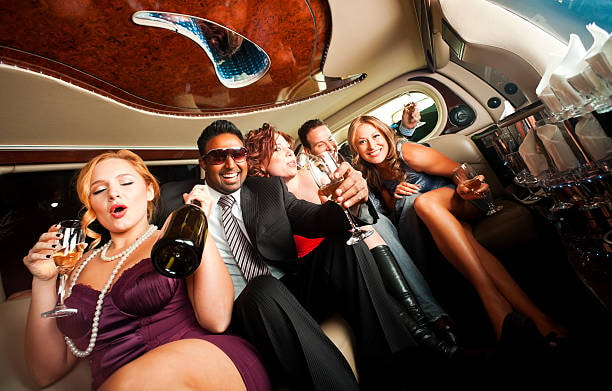 A group partying in out bachelor party limo.